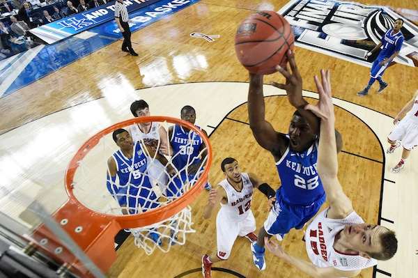 alex-poythress-22-of-the-kentucky-wildcats-goes-up-for-a-shot-as-sam-dekker-15-of-the-wisconsin-badgers.jpg